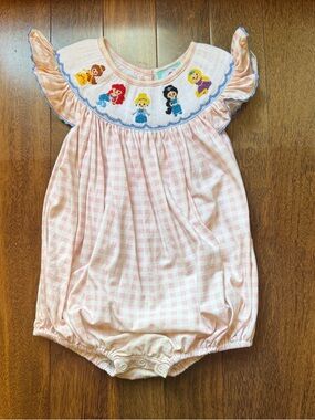 The Smocked Flamingo Pink Gingham Bubble Romper with Embroidered Characters